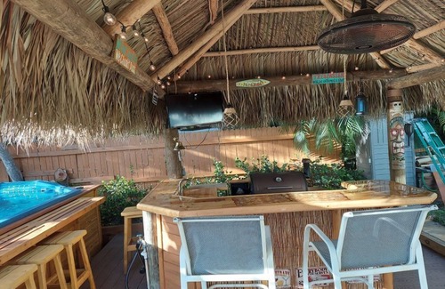 Palm City House | Beautiful Waterfront Hideaway Gem on Bessy Creek w/Swim Spa, Tiki Bar Boat Lift