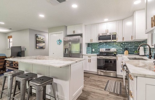 Weeki Wachee Gardens Apartment | Beautiful Weeki Wachee river house with kayaks, slide, and river views