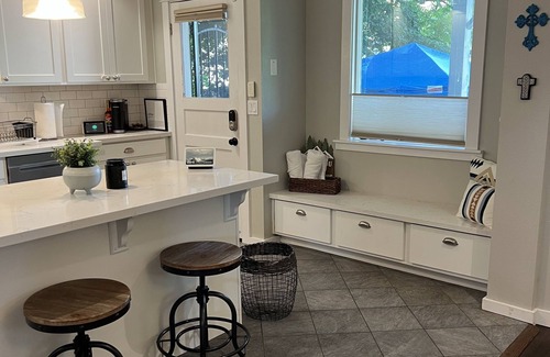 Hilltop House | Beautifully renovated 100yr old craftsman home near Stadium District.