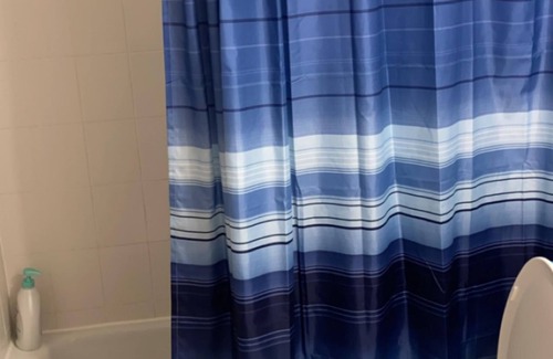 South Weymouth Apartment | Beds in living room space blocked off by curtains!