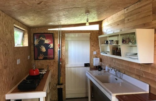 Runham RV Rental | Bell Tent and Chrome Fairground Caravan