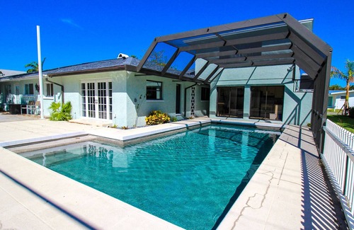 Golden Beach House | Bella Paradiso: Exquisite 5 BR Pool Home with Private Beach Access