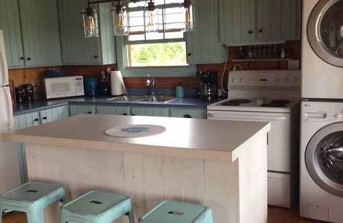 Morell Cottage | Best of all worlds - bright log cabin just a short walk to beautiful PEI beach