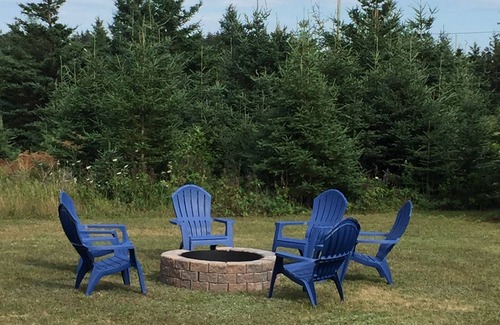Morell Cottage | Best of all worlds - bright log cabin just a short walk to beautiful PEI beach