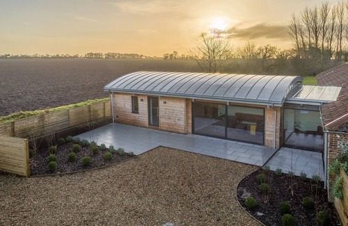 North Walsham House | Big Sky Barn is a contemporary conversion of a 200 year old brick and flint barn
