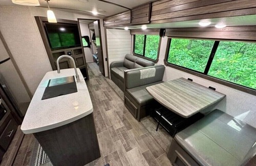 Lucas RV Rental | Black Fork River front fully functioning Camper