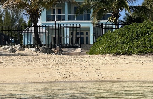 Coral Harbour House | Blue Birds Beach House, right on the beach with a large backyard & heated pool.