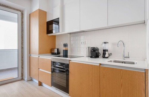 Santo Condestavel Apartment | Blueground | Campo de Ourique, fully furnished