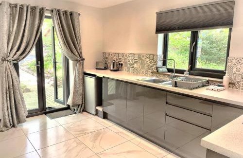 Llanybri Ski Chalet | BlueStone-Hot Tub-Woodlandlodges-Pembrokeshire-Tenby