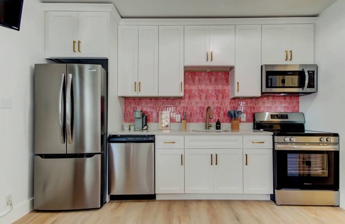 St. Petersburg - Clearwater Cottage | Blushing Flamingo- Triplex with heated pool, across the street from the beach