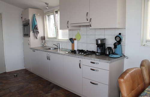 Oudega House | Boat "De Frijheit" overlooking the water