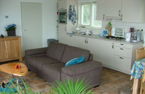 Oudega House | Boat "De Frijheit" overlooking the water