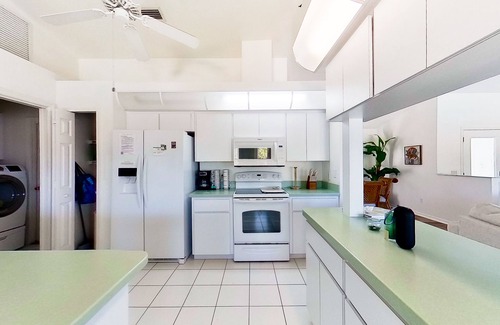 Pebble Beach House | Bohemian canal-front retreat with pool, beach gear, adult bikes, & AC - dogs ok
