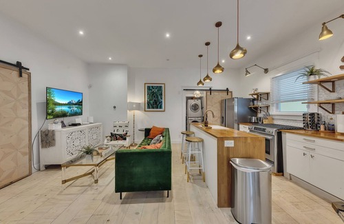 Midtown Apartment | Boho-style 2BR/2BA Midtown triplex with private front patio. King + queen bedrooms, updated kitchen, smart TVs, self check-in, and laundry. Walk to Piedmont Park, Trader Joe’s, and restaurants. Free street parking. No pets.