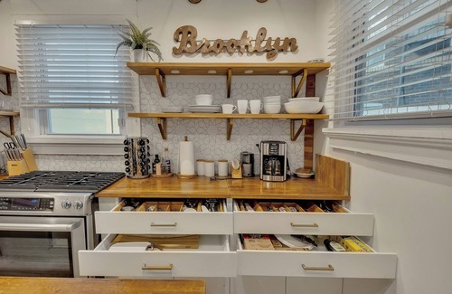 Midtown Apartment | Boho-style 2BR/2BA Midtown triplex with private front patio. King + queen bedrooms, updated kitchen, smart TVs, self check-in, and laundry. Walk to Piedmont Park, Trader Joe’s, and restaurants. Free street parking. No pets.