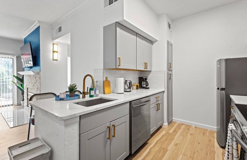 Dallas Condo | Bold & Bright Uptown Pad - Pool Dining Vibes