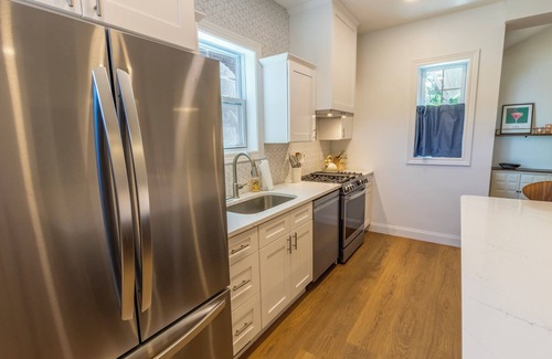 Michigan City House | Bold & Fun Getaway Steps from Train & Beach