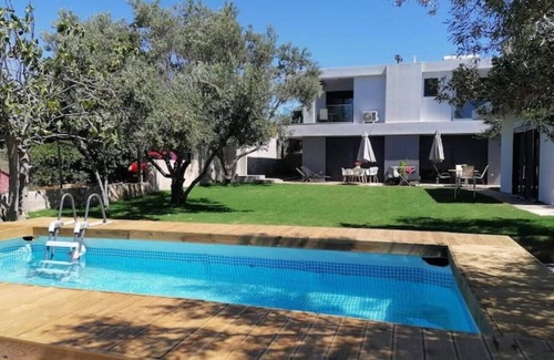 Thymari Villa | Boutique 2BR apartment in villa. Shared pool. Partial seaview