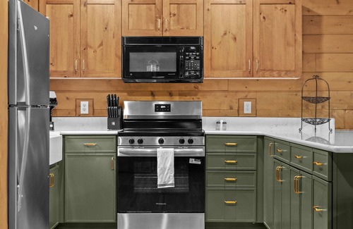 Boyne City Cottage | Boyne Mountain Cabin with Hot Tub Next to Skiing and Golf!