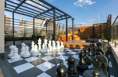 Downtown Johannesburg Apartment | Brand New, City Center Penthouse with Rooftop Hot Tub and Giant Chess Set