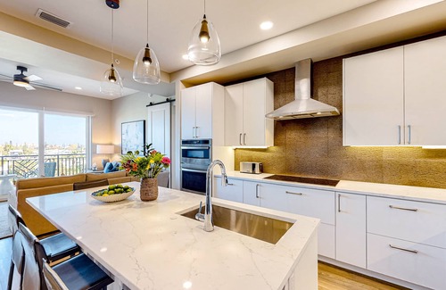 Madeira Beach Condo | Brand-new condo steps to beach with balcony, pool, & hot tub - dog-friendly