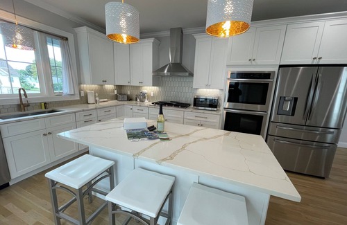 Devon House | Brand new house with water views just steps from beach!