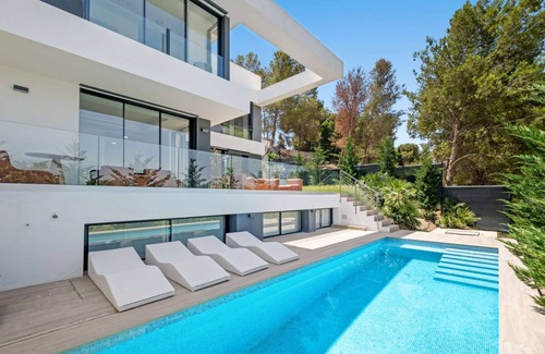 Pinares de San Anton Villa | Brand new spacious 6-bedroom villa with saltwater pool, sea, city, and mountain views.