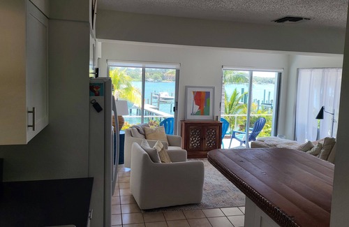 Jupiter Cottage | Brando on blue water palm tree paradise.