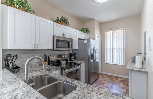 Wellington House | Bright 4BR Townhome | Regal Palms Resort w/Pools, Clubhouse & Fun | Near Disney