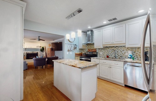 Spring Hill House | Bright & charming beach retreat with large lanai, firepit, & fireplace - dogs ok