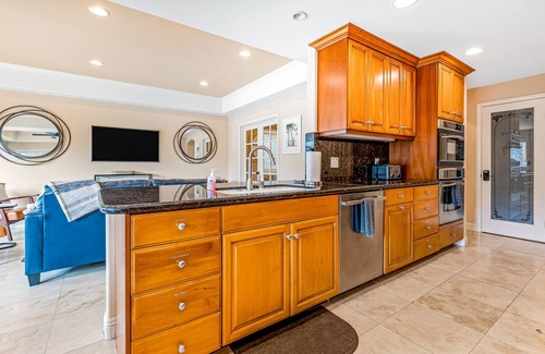 Naples House | Bright home on the channel with expansive patio & elevator