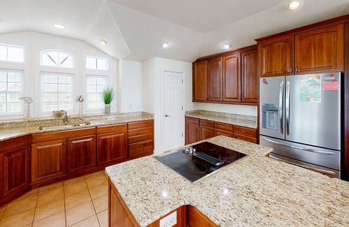 Sandbridge House | Bright & open waterfront home with private pool, sunset views, decks & elevator