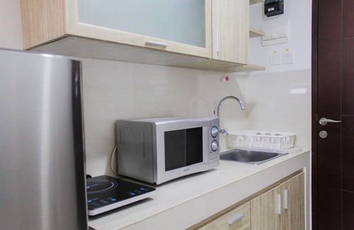 Panunggangan Utara Apartment | Bright Studio Apartment at Springwood Residence