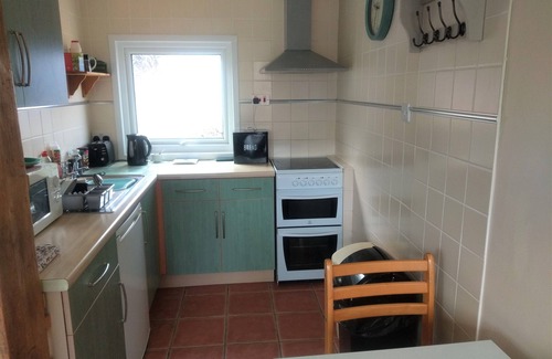 Bucks Cross Ski Chalet | Buck's Cross Bideford Bay Devon chalet has own patio on maintained holiday park.