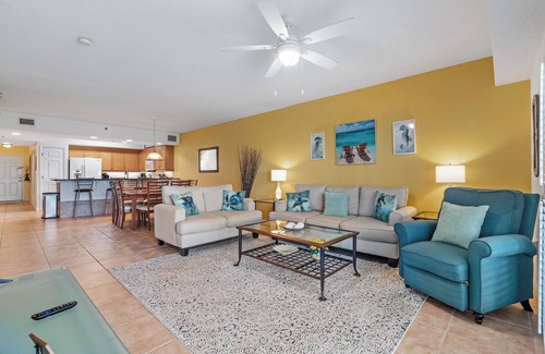 New Smyrna Beach Condo | Build family memories at this 3BR condo in New Smyrna Beach, just steps across the street from the sand. Enjoy a pool & spa outside your door, a luxe master bath, spacious bedrooms, and resort-style amenities in a gated community.
