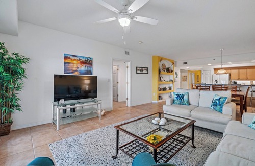 New Smyrna Beach Condo | Build family memories at this 3BR condo in New Smyrna Beach, just steps across the street from the sand. Enjoy a pool & spa outside your door, a luxe master bath, spacious bedrooms, and resort-style amenities in a gated community.