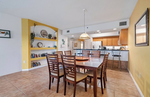 New Smyrna Beach Condo | Build family memories at this 3BR condo in New Smyrna Beach, just steps across the street from the sand. Enjoy a pool & spa outside your door, a luxe master bath, spacious bedrooms, and resort-style amenities in a gated community.