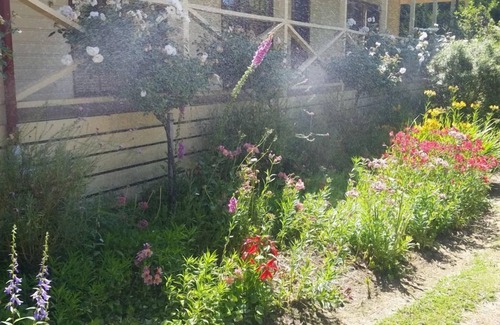 Buxton House | Buxton Gardens by the RivernCountry style home, river flowing thru the backyard