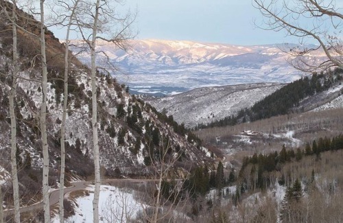 Glenwood Springs Condo | C1: Snuggle into leather couches, a fireplace, a loft and incredible views of the Roaring Fork Valley in this totally remodeled condo.
