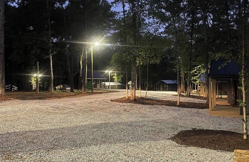 Hartwell RV Rental | Cabin #9: One king-size bed, a kitchenette, and a large gravel parking pad beside the cabin for easy boat or trailer storage.