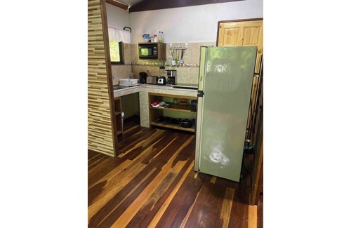 Penas Blancas Cabin | Cabin in La Fortuna with rustic finishes, river and forest