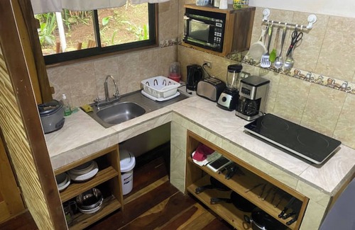 Penas Blancas Cabin | Cabin in La Fortuna with rustic finishes, river and forest
