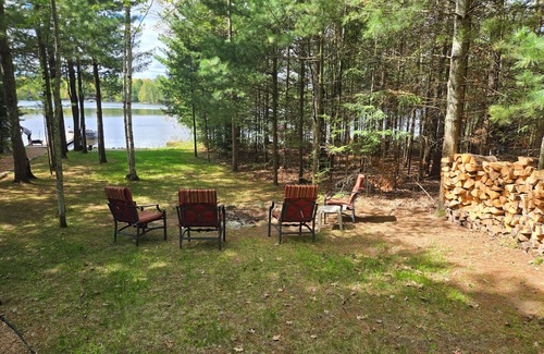 Eagle River House | Cabin on Voyageur Lake–2BR Retreat on ER Chain w/Deck, Firepit & Sandy Beach!