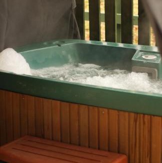 Hendrerwydd House | Caer Fedwen Barns Dyffryn Cottage King bed self catering with Hot Tub