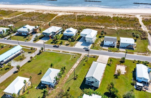 Grand Isle House | Cajun Yacht Club: Spacious 4BR camp in Grand Isle, LA, across from the beach.