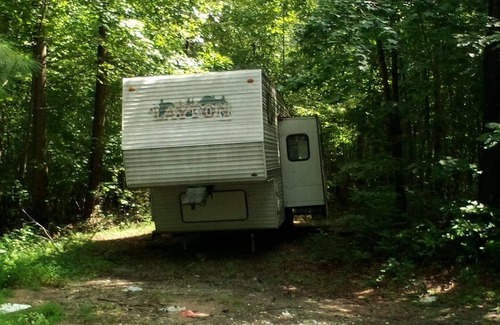 Wake Forest House | Camper off home in wooded property small creek.