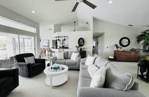 Pinehurst House | Canal Front Charm: Heated Pool, Firepit & Breathtaking Sunset Views