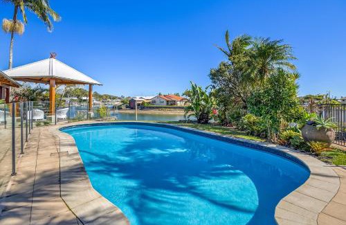 Maroochydore House | Canal Front family Home with extensive outdoor covered areas and pool
