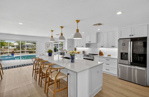 Sanibel House | Canal front ground level beauty steps to the beach