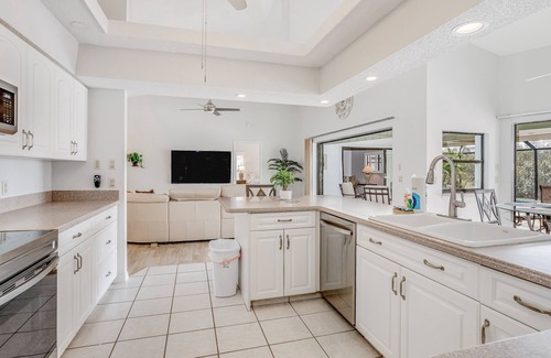 Pebble Beach House | Canal-front home with sandy beaches, golf courses, dock, & refreshing pool